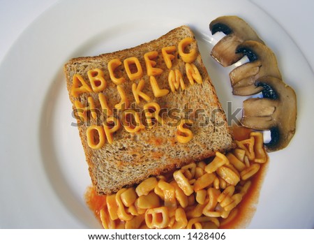 the alphabet spelled out with alphabetti spaghetti on a piece of toast