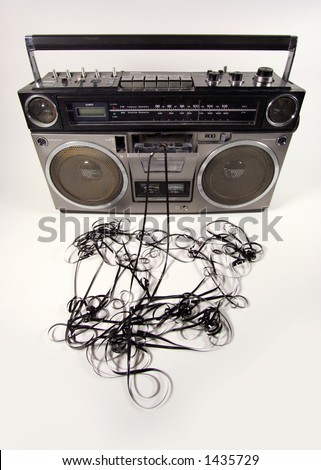 stock photo : cassette tape spewing out of a retro ghettoblaster