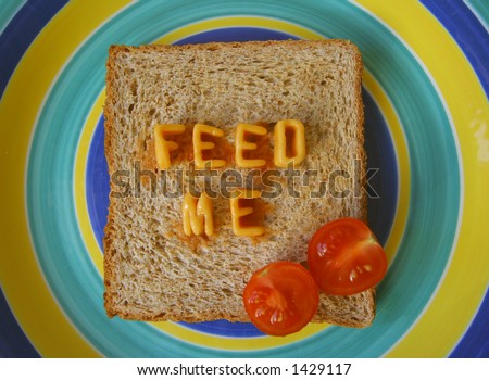 feed me written with alphabetti spaghetti on toast