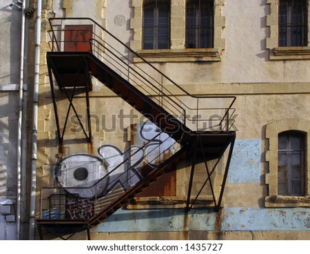 an outside fire escape on an urban building in marseille, france