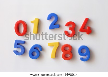 number fridge magnets displaying numbers 0 - 9, messy