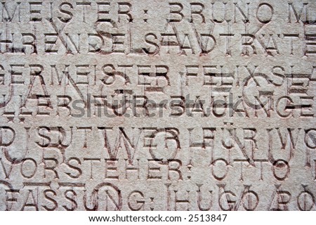 german words engraved on a plaque on building