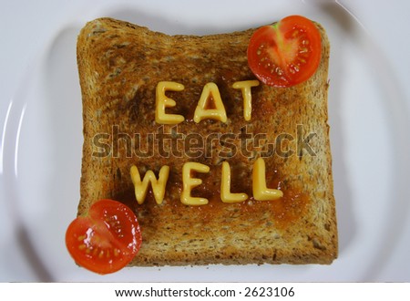 toast with words eat well written with alphabetti spaghetti pasta shapes