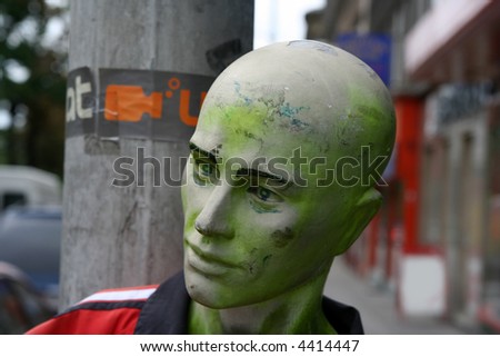mannequin of green man on roadside