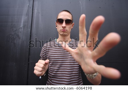 wide-angle shot to give give big hands to a young man