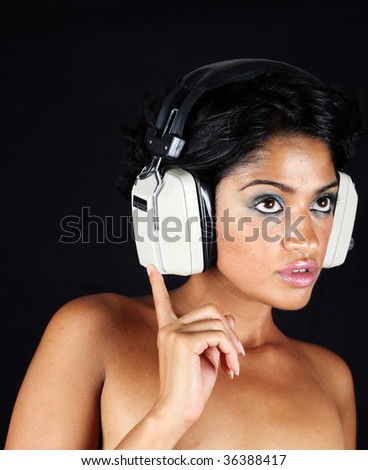 beautiful woman dj wearing retro headphones