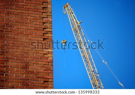 engineering and construction concept of industrial derrick and brick building