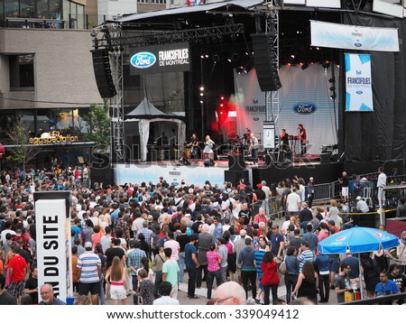 Montreal, Quebec, Canada -  free concert Summer event outdoor entertainment for the family and general public. music, culture, parade, acrobats and lots of fun .