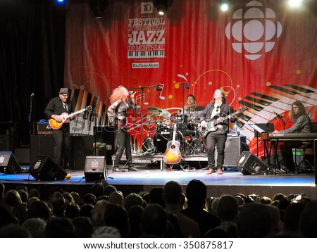 Montreal Quebec Canada - June 26 2015 Diana Fuchs female rock blues vocalist from US in performance on stage with her band at International Jazz Festival .