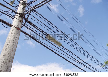 high tension hydro power electricity cable lines live wire overhead with sky background