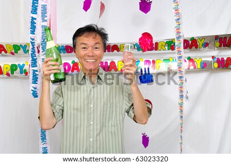 birthday party man with drinks . decoration  off-white background
