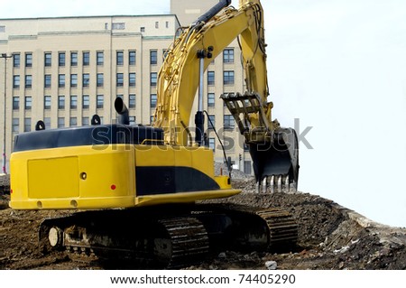 heavy industrial machinery in excavation work site construction in progress.
