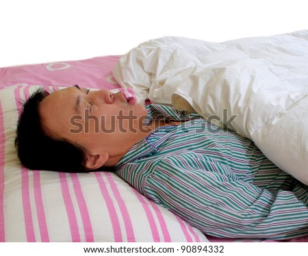sleeping man snoring in bed.