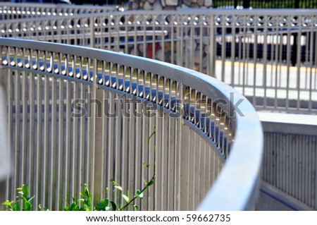 Diagonal, rounded, crisscross fencing in geometrical shapes and patterns.