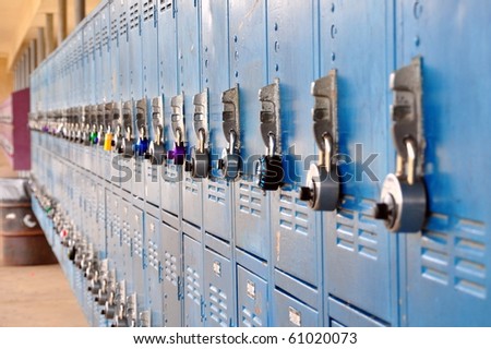 Bank of school lockers with colorful locks.
