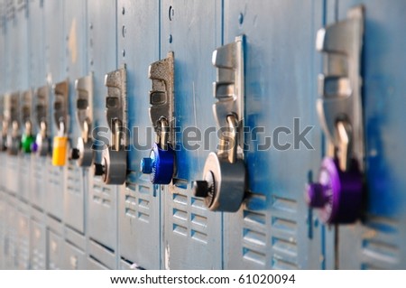 Bank of school lockers with colorful locks.