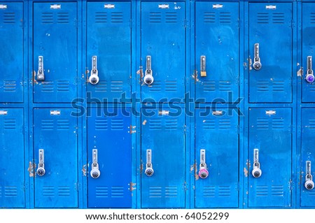Bank of beat up blue school lockers