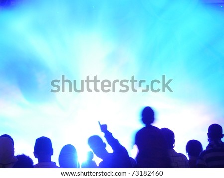 Abstract crowd of people watching light show