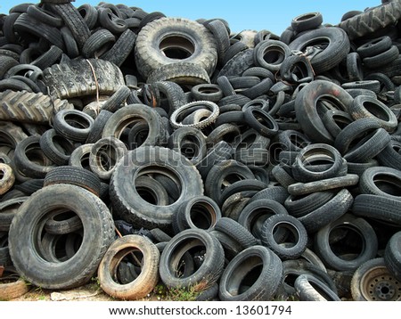 A lot of Wheel Tires dumped in a landfill
