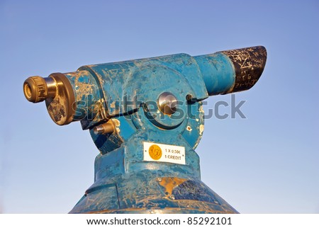 Blue and old coin operated telescope in Spain