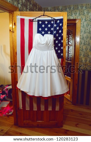 Wedding Dress in Room  on the background of the American flag