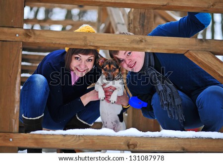 fun couple play with dog Jack Russell in Winter Park