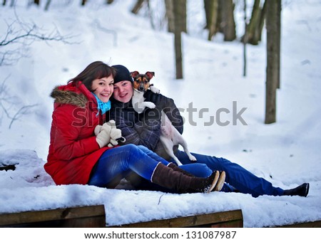 fun couple play with dog Jack Russell in Winter Park
