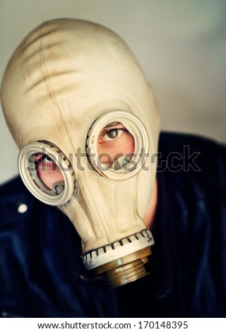 portrait of business man with gas mask