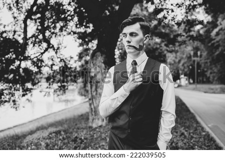 funny groom smokes a pipe