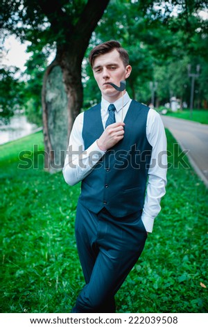 funny groom smokes a pipe