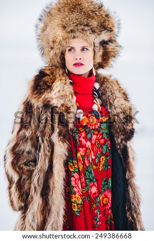 Winter beautiful Girl in Luxury Fur Coat and hat. Fashion Fur.