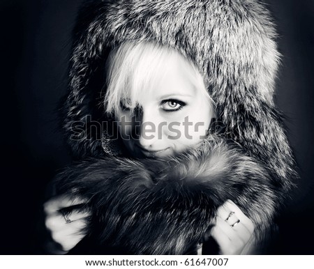 CLose-up beautiful face of young woman in fur hat
