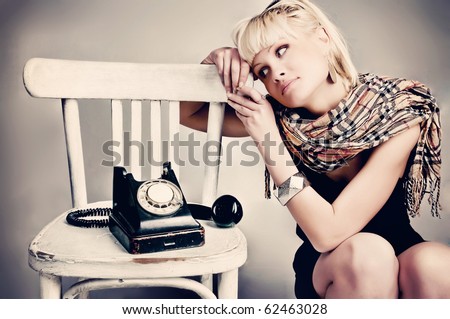 woman with vintage  phone waiting call