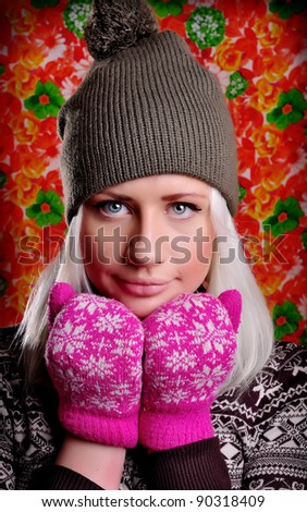 fun bright woman in hat and pink mittens. winter holidays