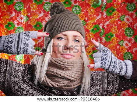 fun bright woman in hat and pink mittens. winter holidays