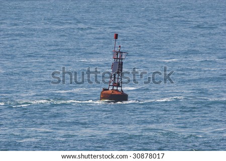 single red buoy as maritime navigation sign