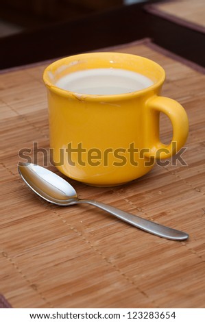 yellow mug with spoon