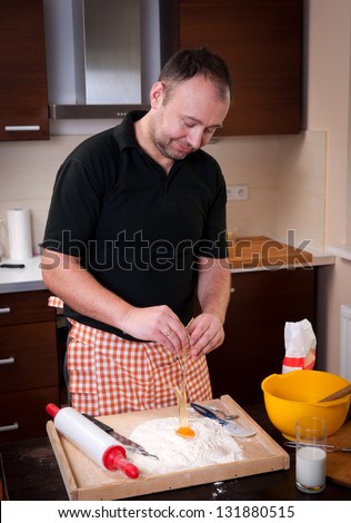 The real Man in the kitchen is making the cake to the dumplings