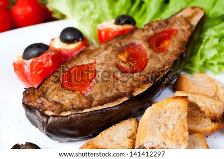 Grilled aubergine with the paste from asparagus with baked tomatoes and mini with pieces of toast