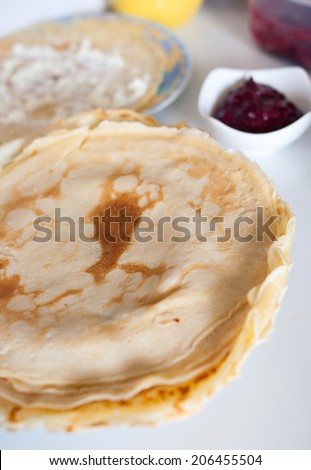homemade pancakes with cottage cheese and fruit sauce in natural light