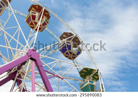 ferris wheel on a summer blue sky