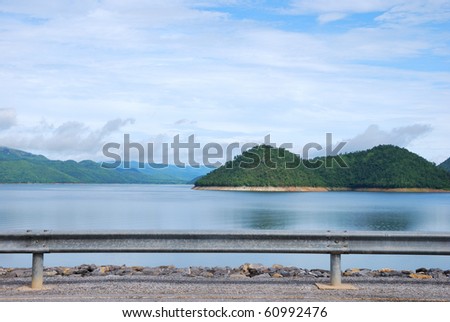 Scenic point of the dam with brighten sky reflection on water surface local name say srinakarin dam, kanchanabury Thailand