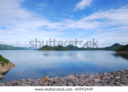 Scenic point of the dam with brighten sky reflection on water surface local name say srinakarin dam, kanchanabury Thailand