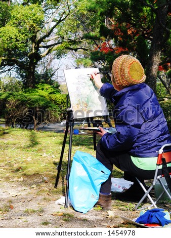 Japanese woman painting picture of Hiroshima Castle