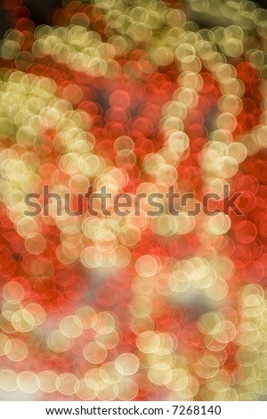 De-focused shimmering dots in Festive Christmas colours, created in-camera with a wide open apperture and a seriously de-focused lens, great background or texture for festive design element.