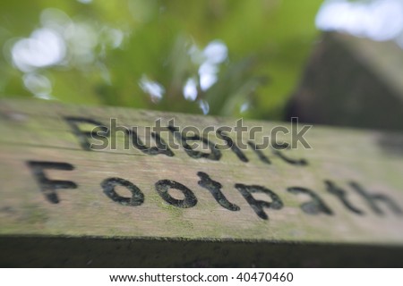 Public Footpath Sign post shot at angle with selective focus.