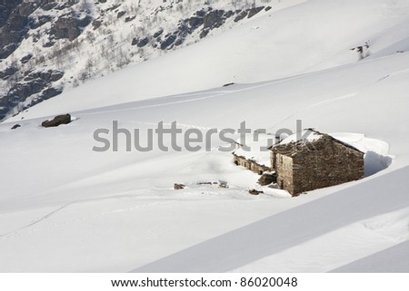 Mountain cabin in the snow in the Alps