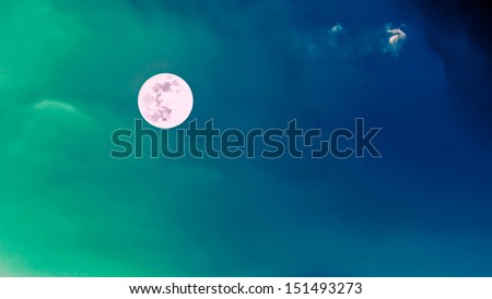 Beautiful full moon with clear blue sky in twilight time background