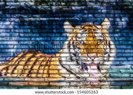 Tiger in water painting on brick wall brick wall surface texture background