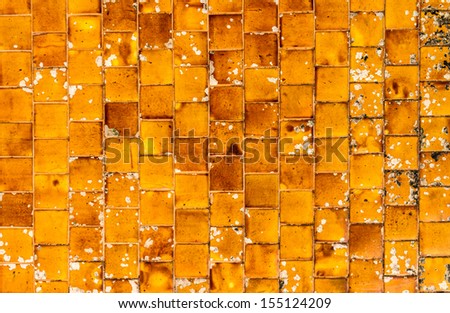 Old and dirty orange mosaic tiles seamless surface background texture